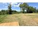 Expansive backyard featuring a wooden deck, ample space for gardening, outdoor activities, or relaxation at 3650 Sentry Rd, Lancaster, SC 29720