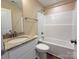 This bathroom features a tub shower, neutral wall color, granite vanity and white shaker cabinets at 3650 Sentry Rd, Lancaster, SC 29720