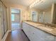 Bathroom with double vanity, granite countertops, and a glass-enclosed shower at 3650 Sentry Rd, Lancaster, SC 29720