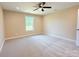 Cozy bedroom with plush carpeting, ample natural light, and ceiling fan at 3650 Sentry Rd, Lancaster, SC 29720