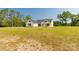 A wide shot of the front exterior of this home and well-kept landscape and long driveway at 3650 Sentry Rd, Lancaster, SC 29720
