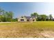 Front exterior of a house that features a long driveway, lush green space, and a well-maintained lawn at 3650 Sentry Rd, Lancaster, SC 29720