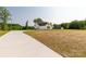 View of home's exterior, showcasing a long drive and green surroundings at 3650 Sentry Rd, Lancaster, SC 29720
