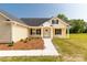 Close exterior showcasing the front facade, small garden, and well kept lawn at 3650 Sentry Rd, Lancaster, SC 29720