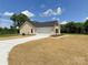Residential home with an attached two-car garage and long driveway on a spacious lot at 3650 Sentry Rd, Lancaster, SC 29720
