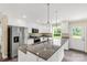 Bright kitchen features white cabinets, granite countertops and stainless steel appliances at 3650 Sentry Rd, Lancaster, SC 29720