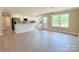 Well-lit kitchen with white cabinets, granite countertops, and stainless steel appliances at 3650 Sentry Rd, Lancaster, SC 29720