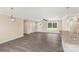 Living room featuring modern gray flooring and a view to the kitchen and backyard at 3650 Sentry Rd, Lancaster, SC 29720