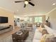 Staged living room showcasing an open floor plan, modern furniture, and ample natural light at 3650 Sentry Rd, Lancaster, SC 29720