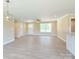 Bright, open living room with hardwood floors and a ceiling fan at 3650 Sentry Rd, Lancaster, SC 29720