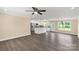 Open-concept living room featuring modern gray flooring and an adjacent kitchen area at 3650 Sentry Rd, Lancaster, SC 29720