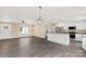 Open-concept living room with a modern kitchen and a beautiful chandelier at 3650 Sentry Rd, Lancaster, SC 29720