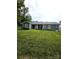 Expansive backyard view of home featuring a well-maintained lawn and landscaping at 414 Fulton Dr, Kings Mountain, NC 28086