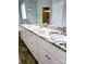 Bathroom boasts double sinks, granite countertop, white cabinets and large mirrors at 414 Fulton Dr, Kings Mountain, NC 28086