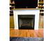Living room fireplace with white mantel and built-in shelving for storage and display at 414 Fulton Dr, Kings Mountain, NC 28086
