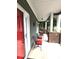 Covered front porch with brick pillars and comfortable seating at 414 Fulton Dr, Kings Mountain, NC 28086