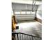 Spacious garage interior featuring a large garage door and ample room for parking and storage at 414 Fulton Dr, Kings Mountain, NC 28086