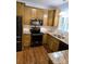 Well-equipped kitchen features stainless appliances, granite counters, tile backsplash and attractive cabinetry at 414 Fulton Dr, Kings Mountain, NC 28086