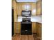 Modern kitchen with stainless steel appliances and wood cabinets at 414 Fulton Dr, Kings Mountain, NC 28086