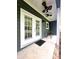 Covered patio with ceiling fans, double doors and seating area at 414 Fulton Dr, Kings Mountain, NC 28086
