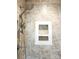 Shower featuring neutral tile, niche, and handheld sprayer at 414 Fulton Dr, Kings Mountain, NC 28086