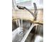 Stainless steel sink and faucet with granite countertops, tile backsplash, and window with blinds at 414 Fulton Dr, Kings Mountain, NC 28086