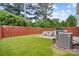 Expansive backyard features artificial grass, a patio set, and a grill for outdoor entertaining at 432 Belton St, Charlotte, NC 28209
