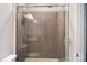 Modern bathroom features a tiled shower with glass doors and updated fixtures at 432 Belton St, Charlotte, NC 28209