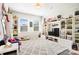 Well-organized ' bedroom featuring custom shelving with toys and lots of natural light at 432 Belton St, Charlotte, NC 28209