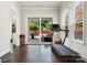 Bright exercise room with hardwood floors and backyard view at 432 Belton St, Charlotte, NC 28209