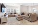Comfortable living room with neutral decor, plush seating, and lots of natural light at 432 Belton St, Charlotte, NC 28209