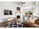 Cozy living area with fireplace, hardwood floors, and a view of the backyard at 432 Belton St, Charlotte, NC 28209