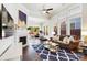 Sun-drenched living room with fireplace, hardwood floors, and sliding doors to the patio at 432 Belton St, Charlotte, NC 28209