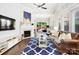 Bright living room boasts fireplace, hardwood floors, and backyard access at 432 Belton St, Charlotte, NC 28209