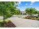 Neighborhood street view with mature trees, green grass and inviting landscape at 432 Belton St, Charlotte, NC 28209