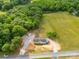 Aerial shot of a single Gathering home with a long driveway and a shed at 4328 Camden Rd, Marshville, NC 28103
