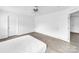 Bright bedroom with light wood floors, neutral walls and multiple doorways is ready for your personal touch at 4328 Camden Rd, Marshville, NC 28103