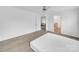Bright bedroom featuring hardwood flooring, a ceiling fan, large windows, and white walls at 4328 Camden Rd, Marshville, NC 28103
