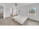 Bright bedroom featuring hardwood flooring, a ceiling fan, large windows, and white walls at 4328 Camden Rd, Marshville, NC 28103