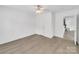 Bright bedroom featuring wood-look floors, ample space, and neutral walls creates a peaceful retreat at 4328 Camden Rd, Marshville, NC 28103