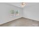 Bright bedroom with natural light from double windows and wood-look floors, perfect for relaxation at 4328 Camden Rd, Marshville, NC 28103