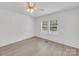 Bedroom with natural light from double windows and wood-look floors is a peaceful retreat at 4328 Camden Rd, Marshville, NC 28103