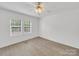 Bedroom featuring natural light from double windows and wood-look floors to enjoy your personal space at 4328 Camden Rd, Marshville, NC 28103