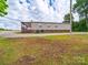 Exterior view of the home, featuring a covered porch and gravel driveway at 4328 Camden Rd, Marshville, NC 28103