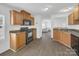 A kitchen with wood cabinets, black appliances, and hardwood floors at 4328 Camden Rd, Marshville, NC 28103