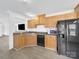 Functional kitchen featuring wood cabinets, modern appliances, and durable countertops and flooring at 4328 Camden Rd, Marshville, NC 28103