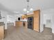 Open concept kitchen with hardwood floors and wooden cabinets at 4328 Camden Rd, Marshville, NC 28103