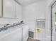 Functional laundry room featuring washer, dryer, and extra storage cabinets at 4328 Camden Rd, Marshville, NC 28103
