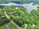Scenic aerial view of a lake community surrounded by lush greenery and the lake at 4585 Sunrise Beach Rd, Catawba, NC 28609