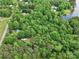 Aerial view of lush land including a lake at 4585 Sunrise Beach Rd, Catawba, NC 28609